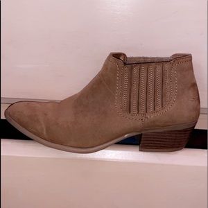 Brown wedge heeled boots.